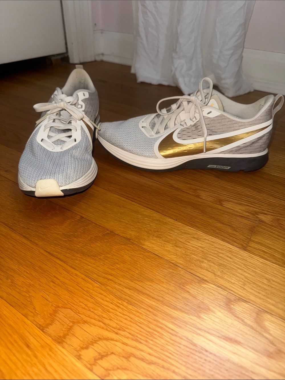 Nike Women’s Light Gray and Gold Running Sneakers